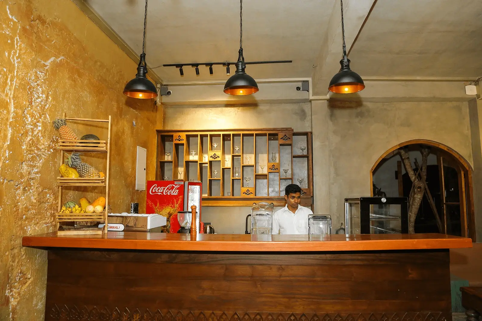 The view of juice bar at the restaurant and a man is sitting nearby
